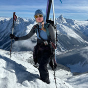 a skier wearing a Convict Canyon Hoodie in Winter Blue