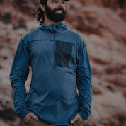 A man wearing a Ridge Solstice Pro Sun Hoodie