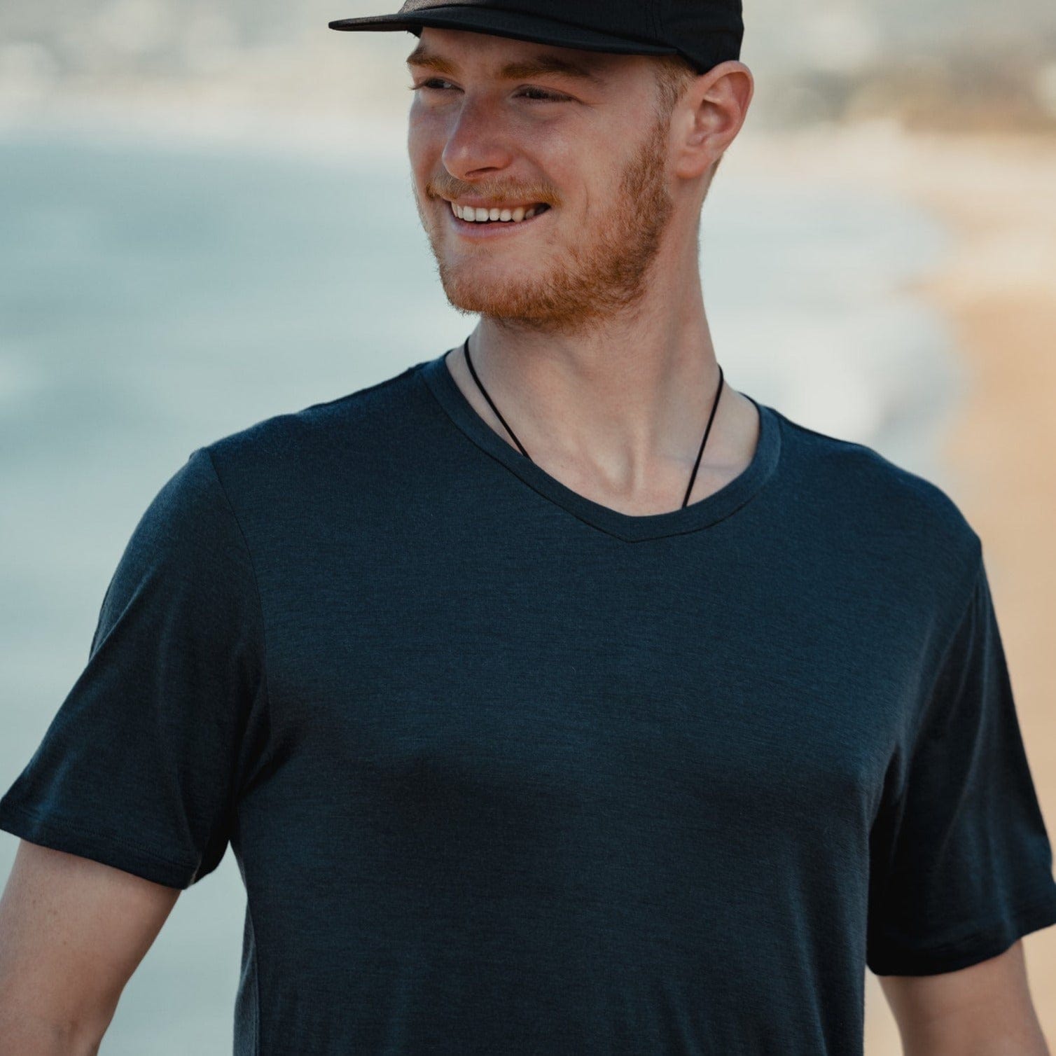 man wearing a Journey V-Neck Merino Wool T-Shirt and Ridge Merino hat