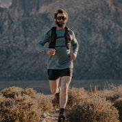 a man running in a Pursuit long sleeve shirt