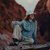 a woman wearing a blue Solstice Sun Hoodie