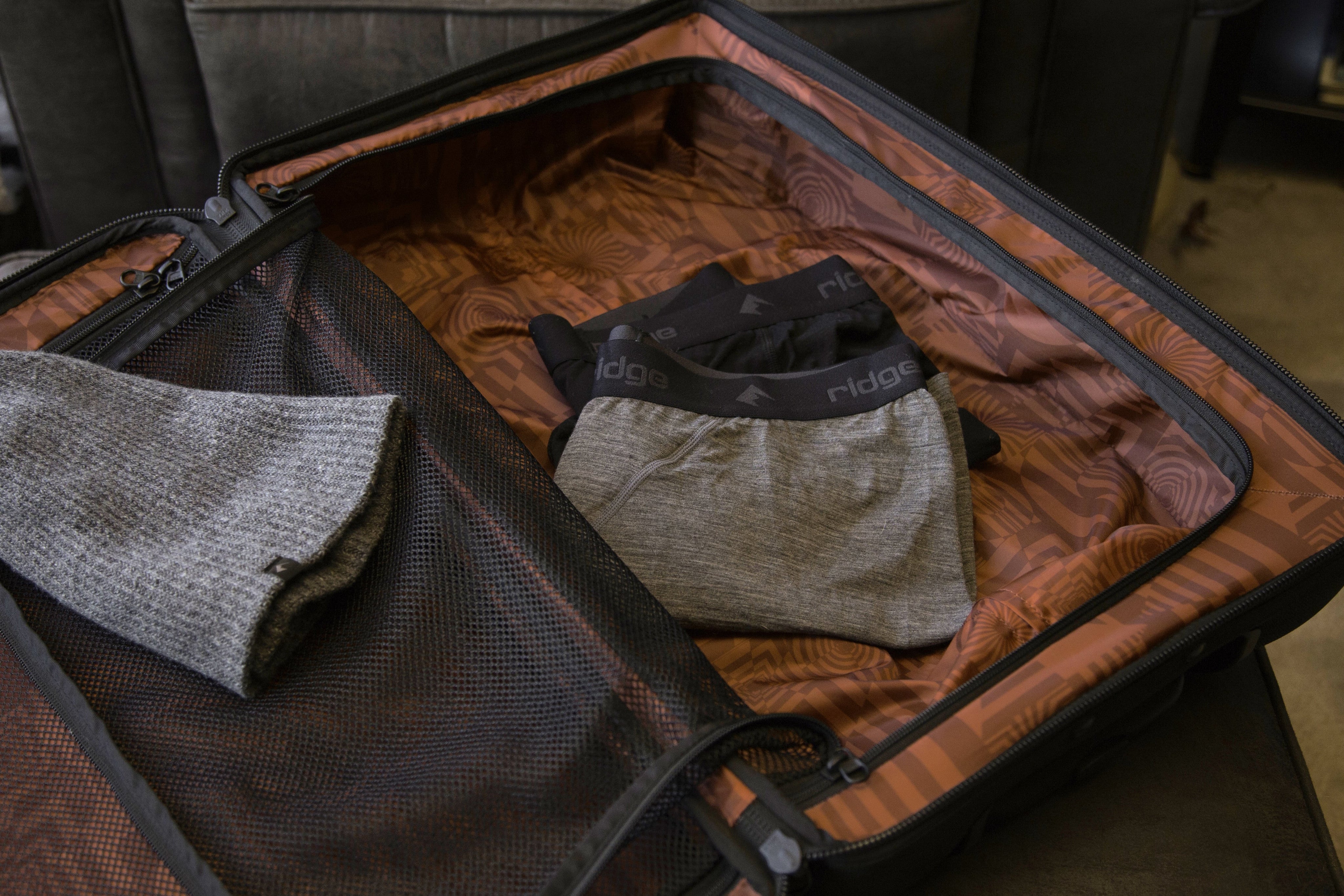 Ridge Merino underwear and beanie in a suitcase